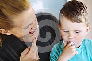 Mother and child eating a cake / desert with their fingers