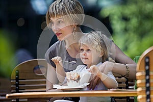 Mother and child eating ice creams