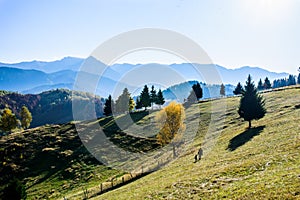 Mother and child enjoying a mountain autumn landscape