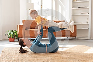 Mother and Child Enjoying Playtime Together In Living Room Setting photo