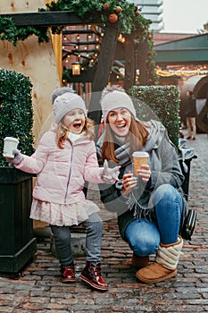 Mother with daughter on winter Christmas market in Toronto