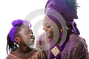 Mother and child girl looking to each other.African traditional clothing