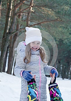 Mother and child girl on a winter walk