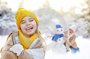 Mother and child girl on a winter walk