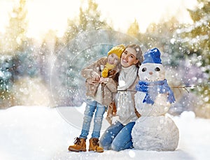 Mother and child girl on a winter walk