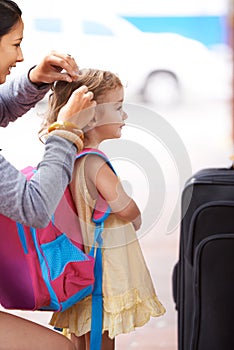 Mother, child and hair with suitcase travel or waiting at airport for journey to America, adventure or outdoor. Female