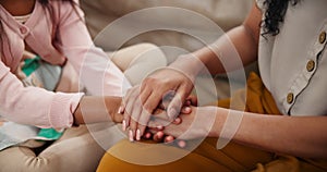 Mother, child and hands in care, support or trust for love, concern or confession on living room sofa at home. Closeup