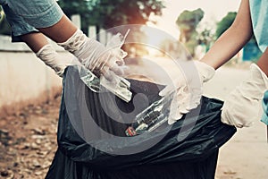 Mother and child help picking up trash