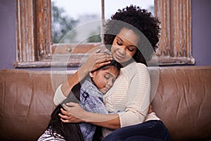 Mother, child and hug on sofa with love for bonding connection with security, support or trust. Woman, daughter and