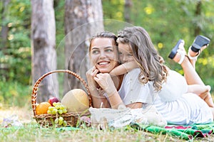 Mother and child love. Mother and child girl playing kissing and hugging. Little daughter hugging her happy mother.