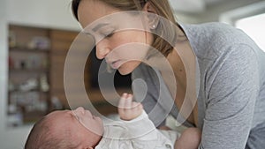 Mother and child. Mom calms, cradles a crying newborn baby. Mothers Day