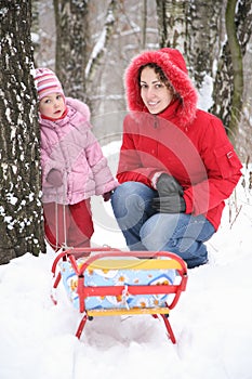 Mother with child in park at winter 2