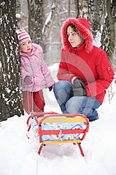 Mother with child in park at winter