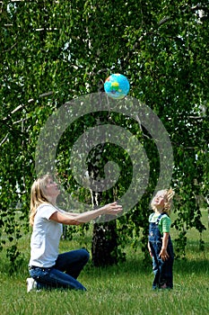 Mother and child play with ball