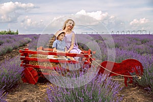 Mother and child playing in lavender field