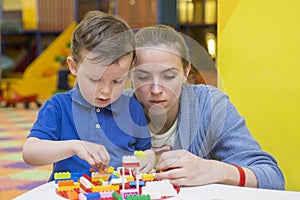 Mother and child playing together, build from the constructor