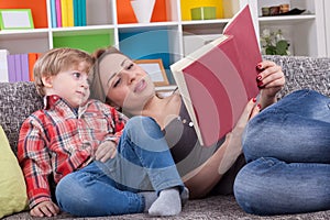 Mother and child reading a book