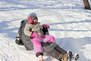 Mother and child sledging