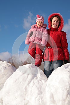 Mother and child on snowdrift