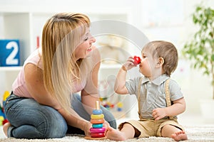 Mother with child son play having fun pastime photo