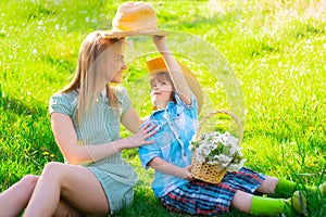 Mother and child at spring picnic. Outdoor leisure. Happy summer family at park.