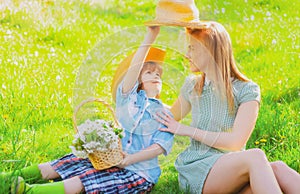 Mother and child at spring picnic. Outdoor leisure. Happy summer family at park.