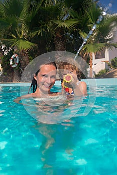 Mother and child in swimming pool