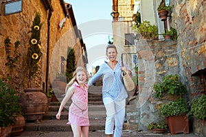 Mother and child tourists in Tuscany, Italy having excursion