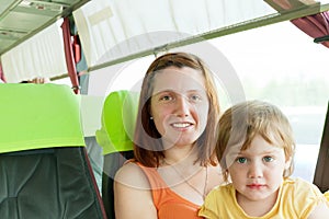 Mother and child traveling in autobus,