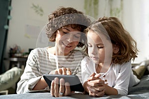 Mother with child using smartphone