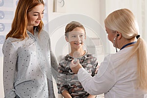 Mother with child visiting doctor