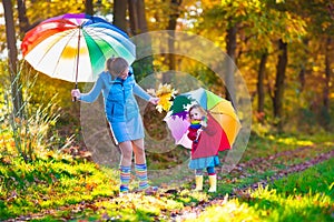 Mother and child walking in autumn park