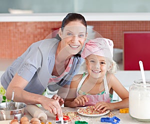 Mother and childing in Kitchen Smiling at Camera