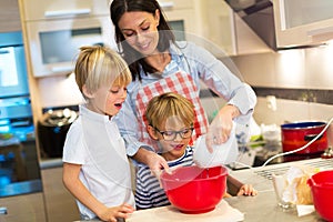 Mother and children baking together