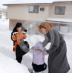 Mother And Children In Blizzard