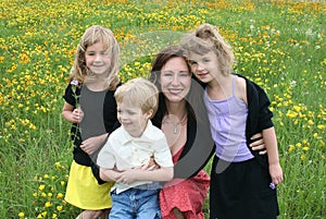 Mother and Children in Flower Field