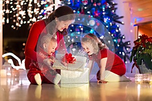 Mother and children at home on Christmas eve