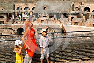 Mother and children, inside arena in Coliseum