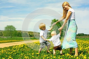 Mother and Children Playing Outside