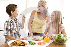 Mother And Children Prepare A meal