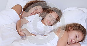 Mother and children sleeping