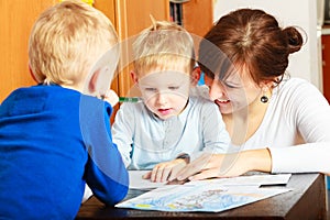 Mother and children sons drawing together