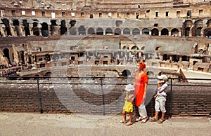 Mother and children, standing in Coliseum