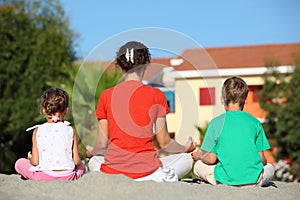 Mother with children turned the backs