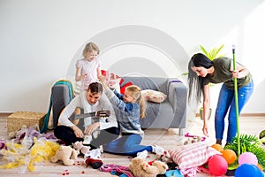 Mother cleaning mess at home
