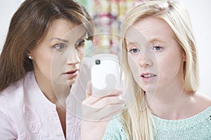 Mother Comforting Daughter Being Bullied By Text Message