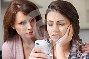 Mother Comforting Daughter Victimized By Text Bullying