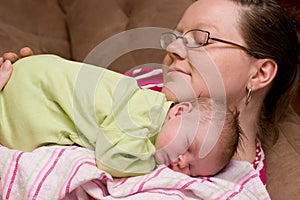 Mother Comforts Sleeping Baby Girl