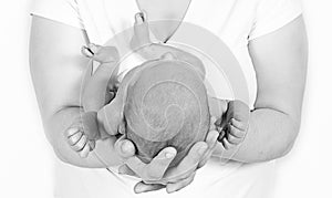 Mother cradling newborn baby