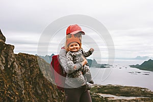 Mother and cute baby hiking together family travel vacations